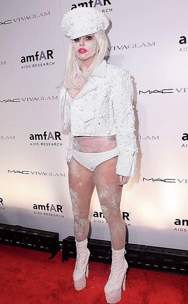 One look at Lady Gaga would make it seem that she had been rolling on the ground. That’s just a throwback to the Born This Way singer’s 2010 amfAR New York Gala look where she turned up wearing a motorcycle jacket by Haus of Gaga and a pearl-encrusted bikini with matchy cap, finished with white body make-up, red lips and tiny pearls glued to her face! Outrageous and how!