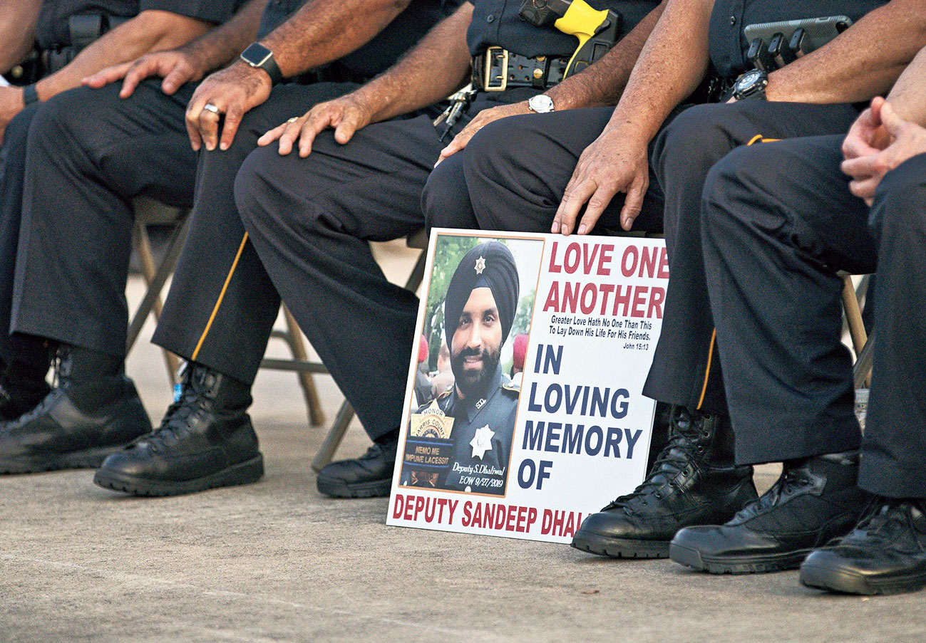Harris county sheriff’s office deputies at a vigil for deputy Sandeep Dhaliwal in northwest Houston. Dhaliwal was killed during an ambush at a traffic stop in Houston. 