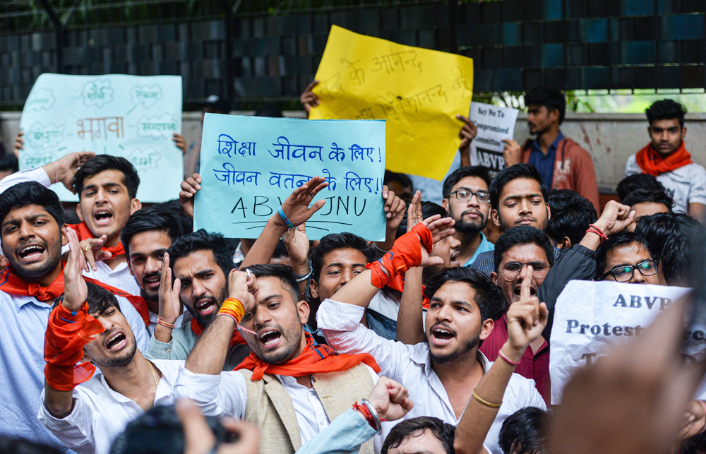 Jawaharlal Nehru University (JNU), Akhil Bharatiya Vidyarthi Parishad (ABVP) and Delhi University Students Union (DUSU) students raise slogans during a protest march from Mandi House towards Jantar Mantar pressing for their demands, in New Delhi, Thursday, Nov. 21, 2019. 