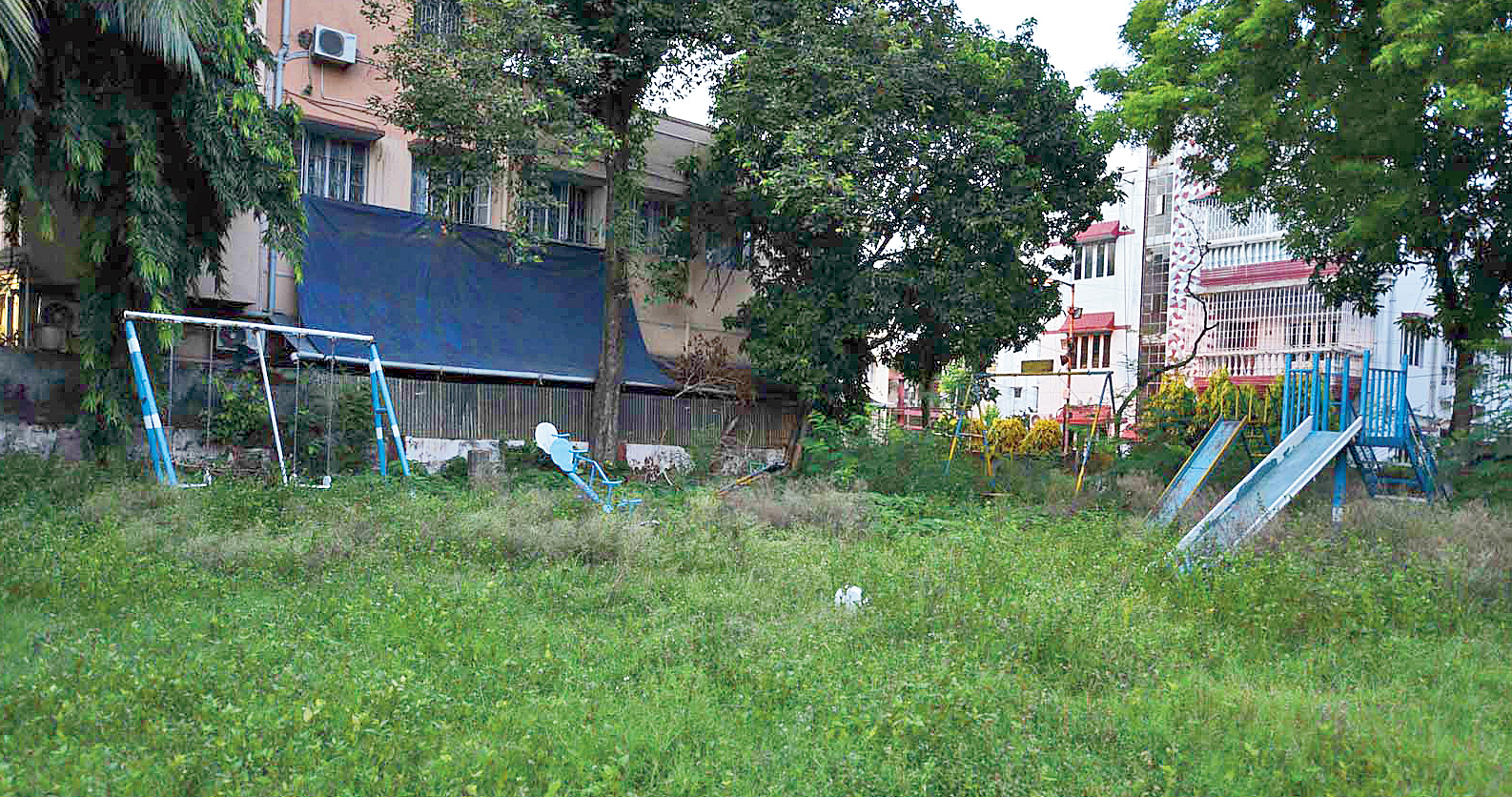 AC Block: Children cannot reach swings, slides and see-saws because of the tall grass and weeds around them. The park was spruced up with new play tools in 2015. Residents said the compound was infested with snakes and it plunged into darkness after sundown