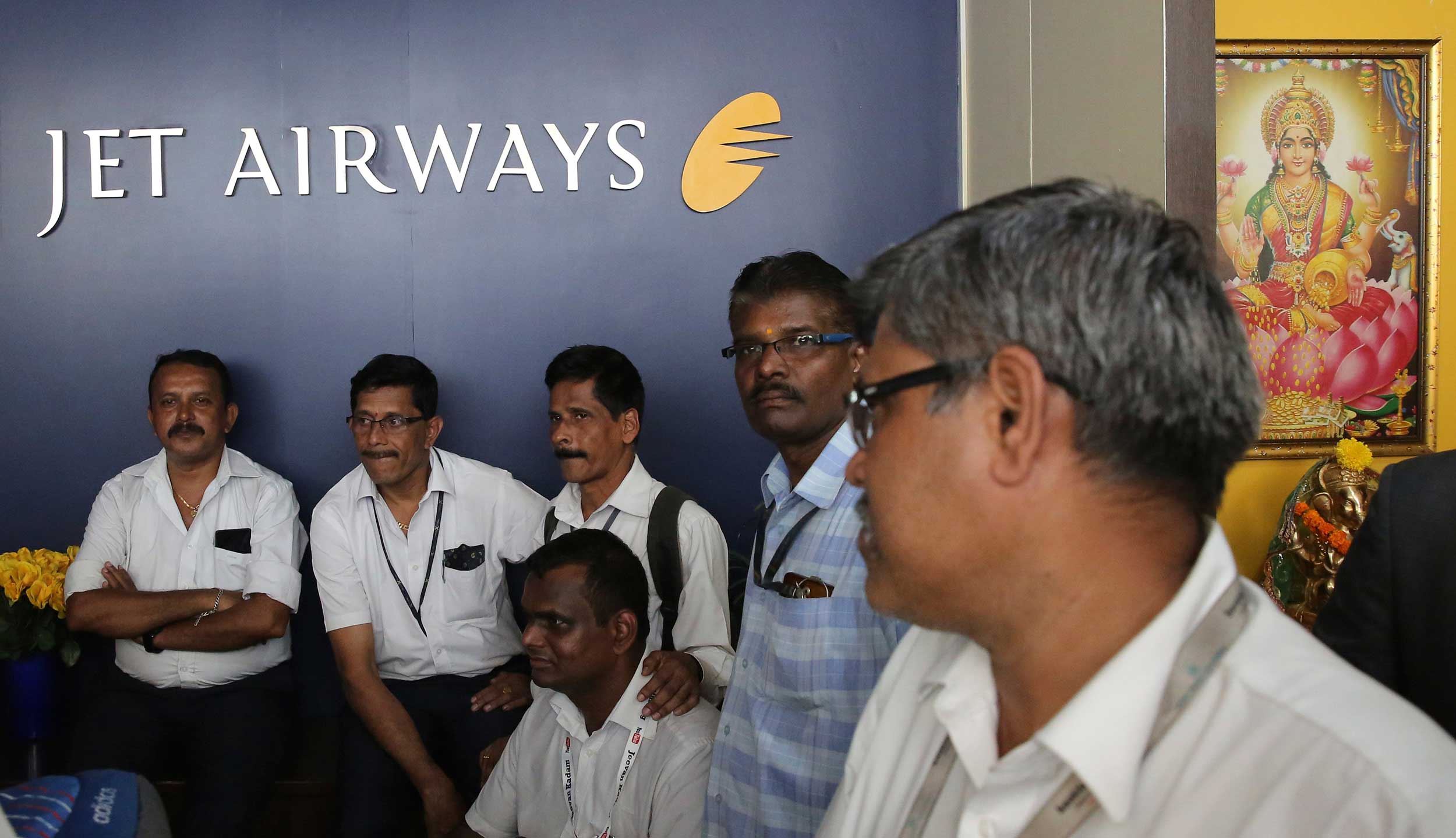 Employees of Jet Airways gather to demand clarification on unpaid salaries at the company headquarters in Mumbai, on April 18, 2019.