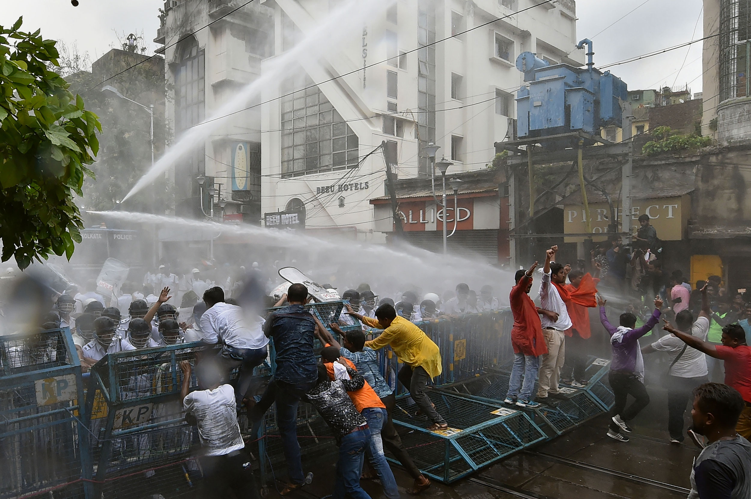 Police personnel use water cannons against BJP activists during their ''Lalbazar Abhiyan'' protest in Calcutta, on June 12, 2019. 