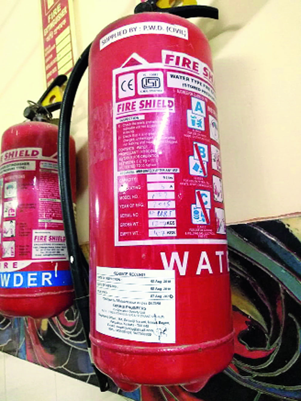 Fire extinguishers are seen hanging from the walls