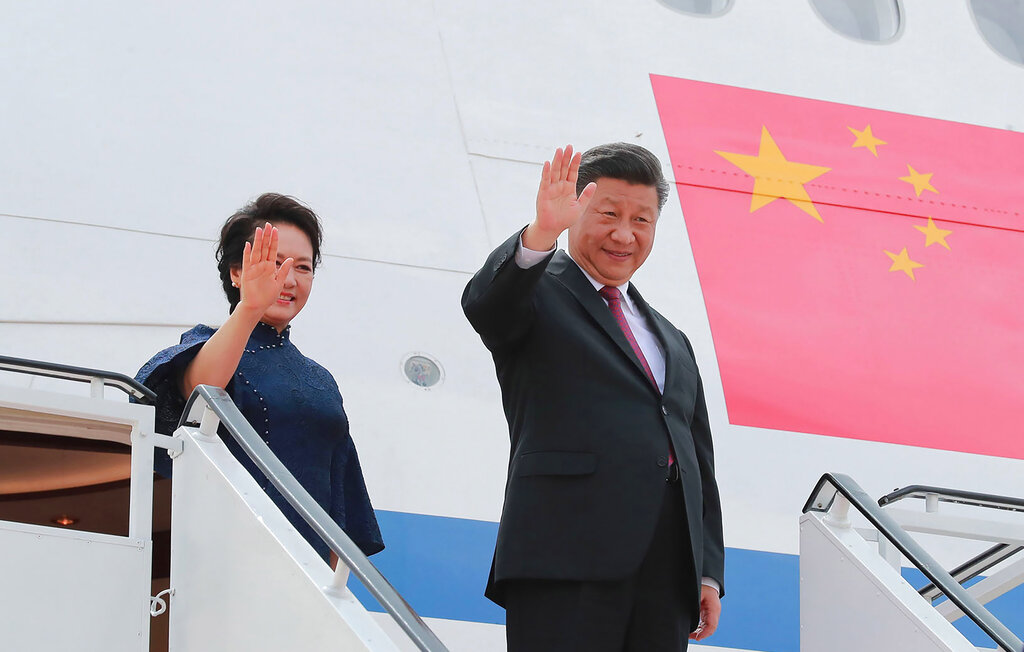 Chinese president Xi Jinping and his wife Peng Liyuan wave as they depart Pyongyang, North Korea, on Friday, June 21, 2019. Xi held a detailed telephone talk with US president Donald Trump on June 18, preparing ground to resolve differences and end the year-long trade war between their countries
