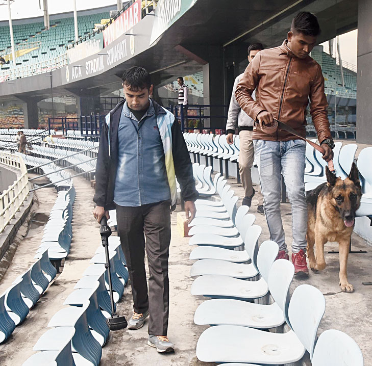 Security personnel scan ACA stadium with the help of sniffer dogs on Friday.