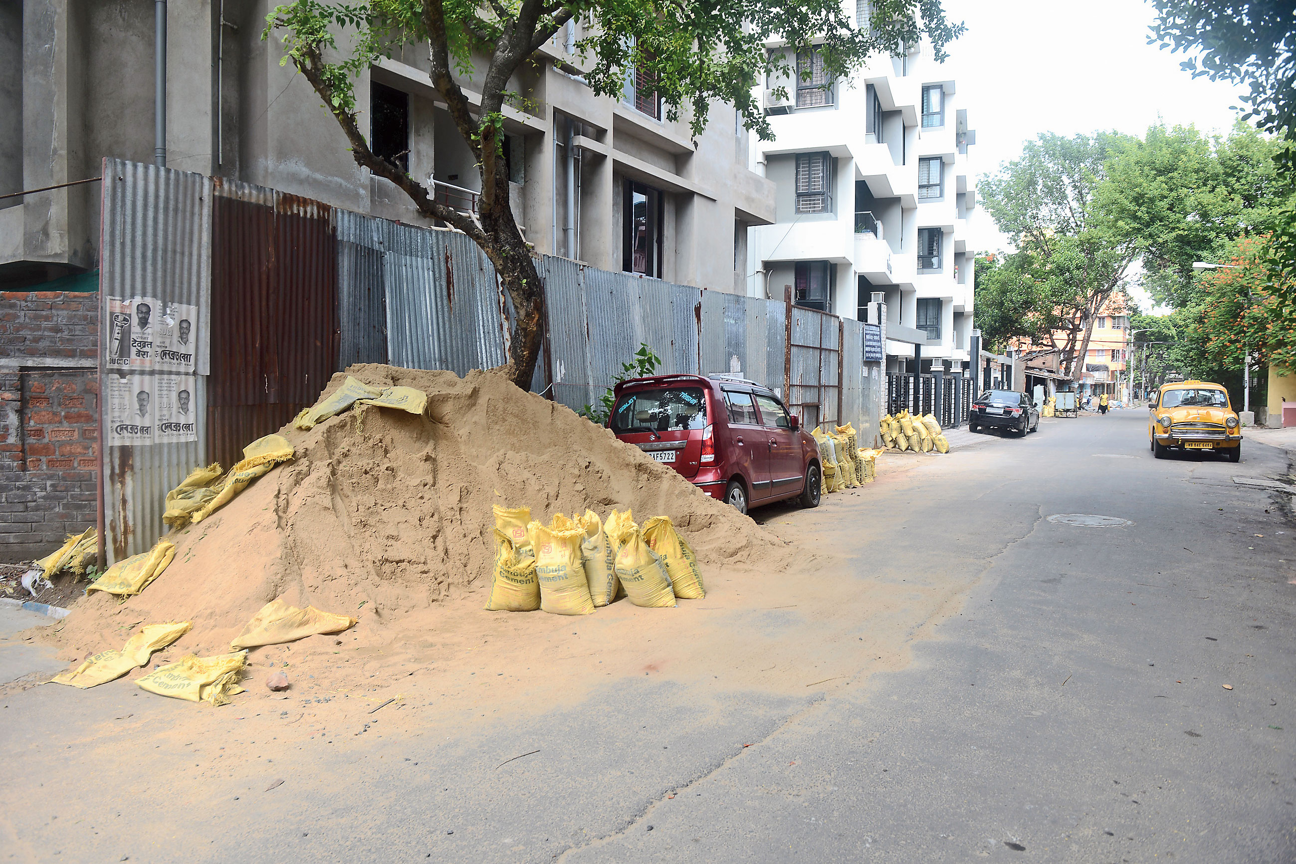 Construction materials dumped on Peary Mohan Roy Road in Chetla on August 5. 