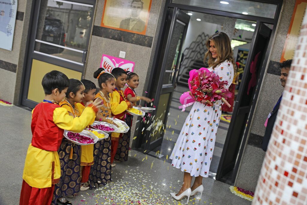 US First Lady Melania Trump is greeted by children upon her arrival at Sarvodaya Co-Educational Senior Secondary School in New Delhi