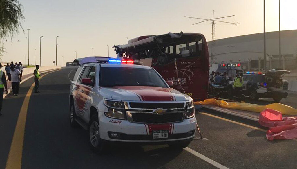 This image released by Dubai Police Headquarters shows the aftermath of the bus crash on Friday, June 7, 2019, in Dubai.The bus, from Oman, smashed into a warning sign coming off a major highway, killing more than a dozen people