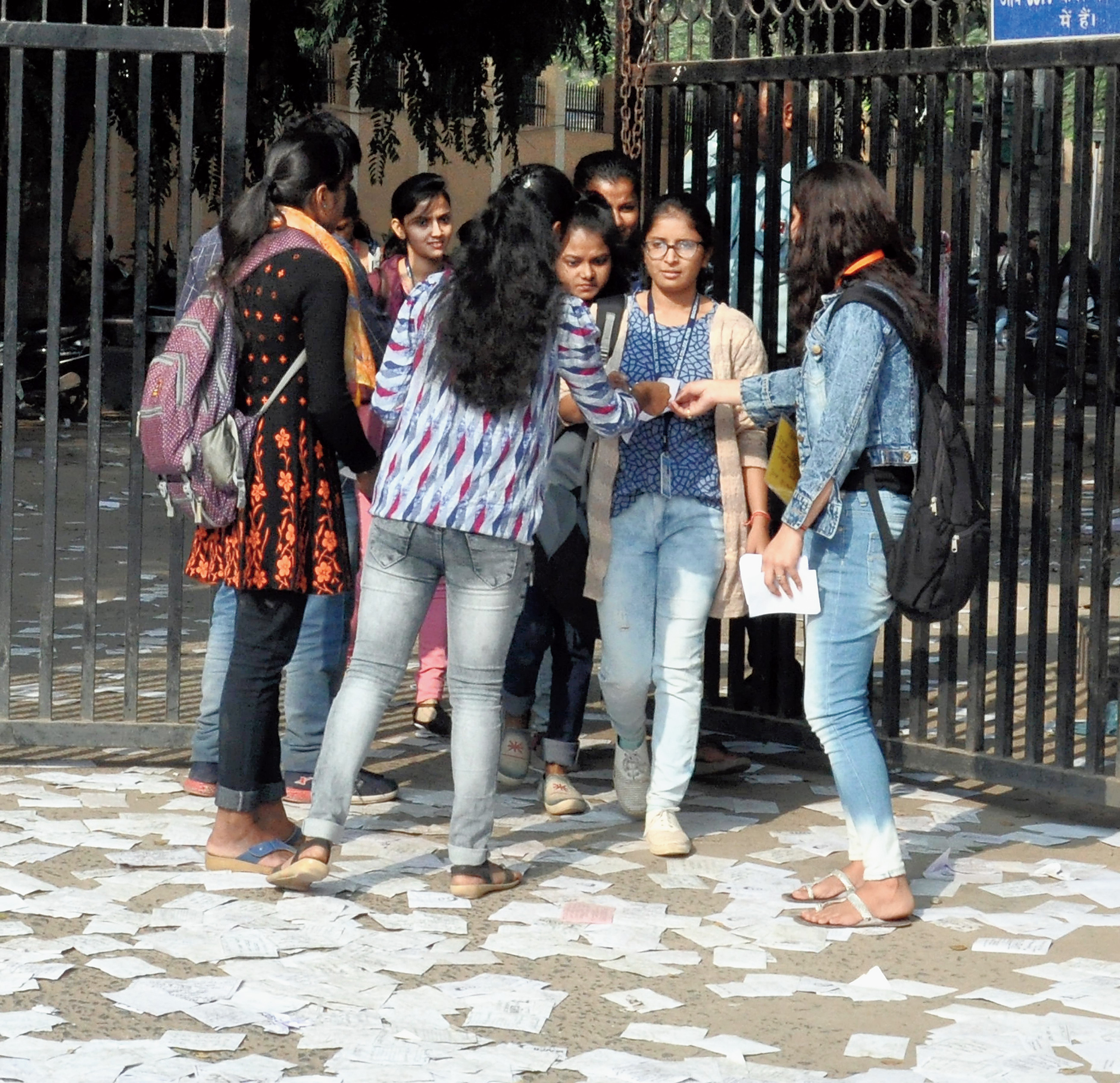 Last lap: Students hand out election pamphlets to girls walking out of Magadh Mahila College on Monday. 