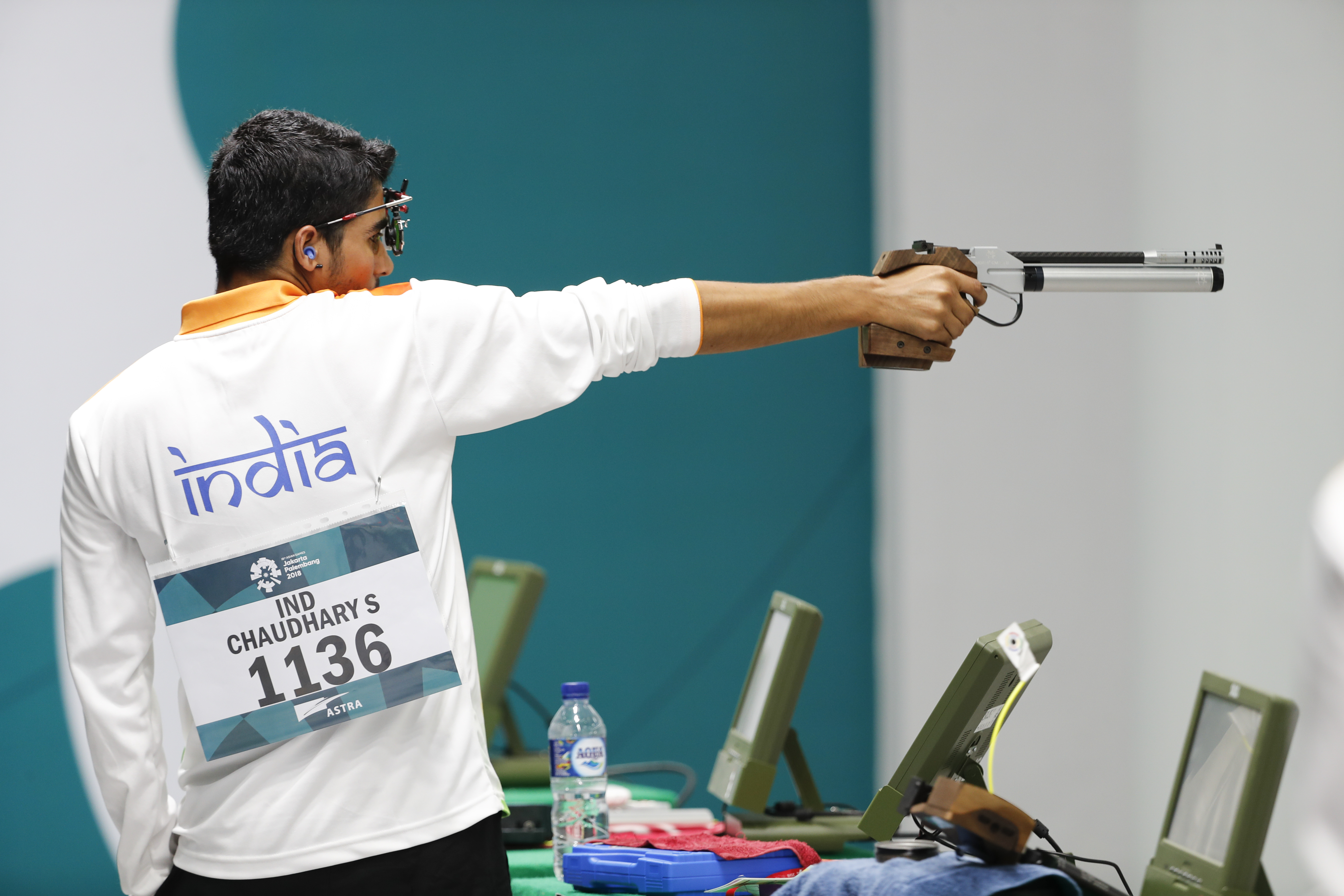 Saurabh Chaudhary takes aim in the final round of the 10m air pistol men's final shooting event at the 18th Asian Games in Palembang, Indonesia.