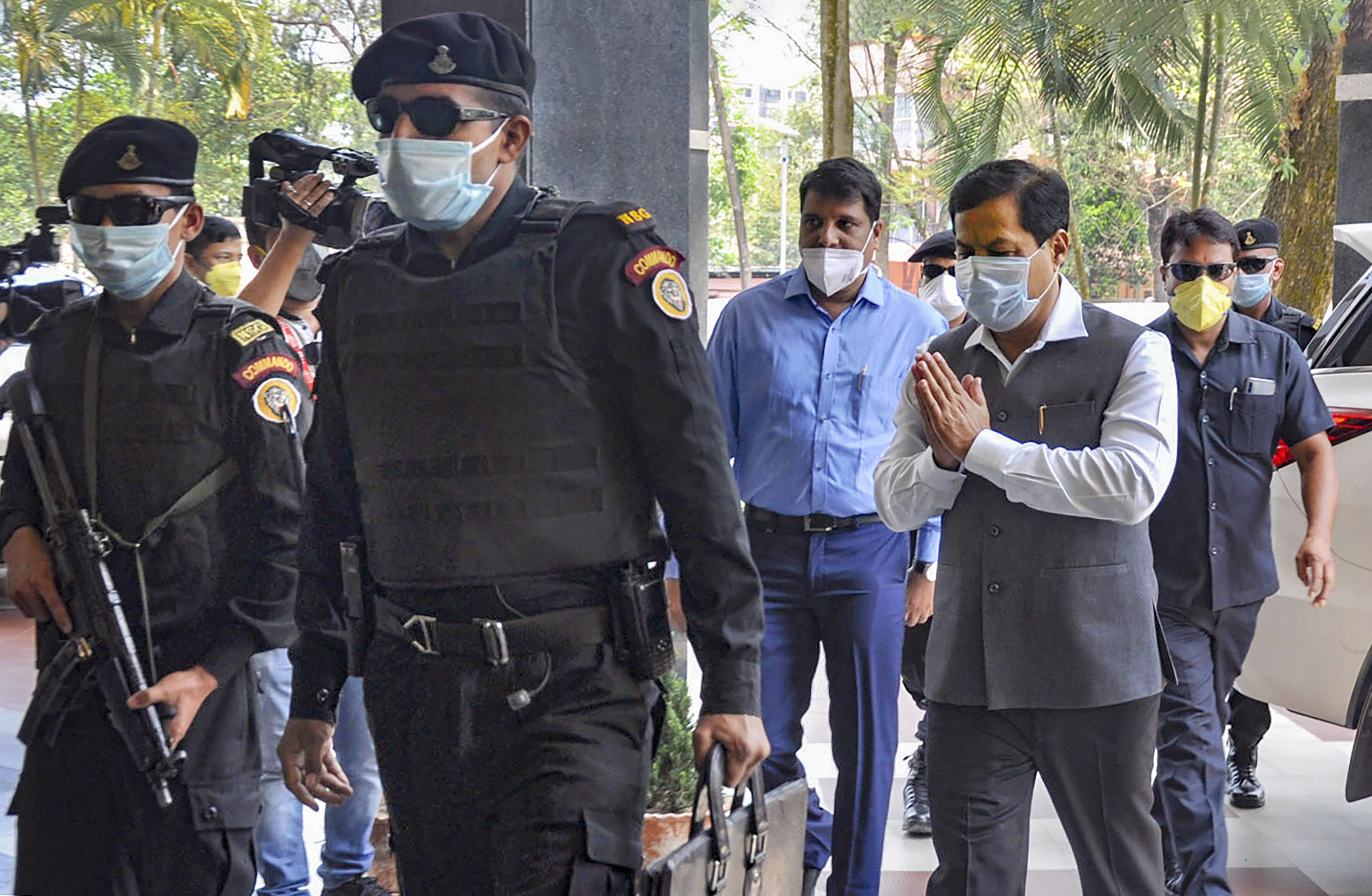  Assam Chief Minister Sarbananda Sonowal wearing a protective mask arrives to attend a special meeting on COVID-19 lockdown in Guwahati on Sunday