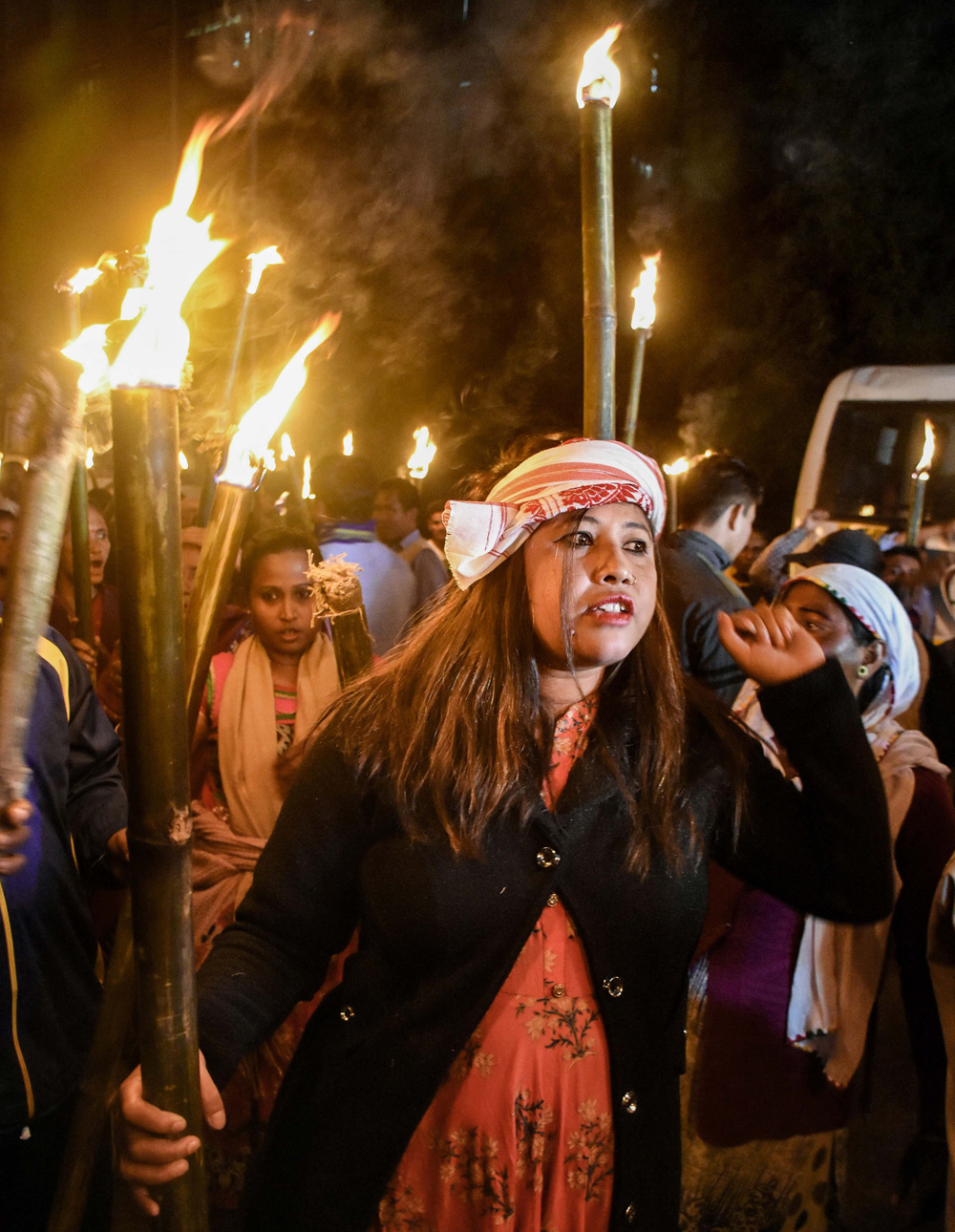 Activists of the Krishak Mukti Sangram Samiti taking part in a torchlight rally during a protest against the Citizenship Amendment Bill, in Guwahati, Monday, December 9, 2019. 