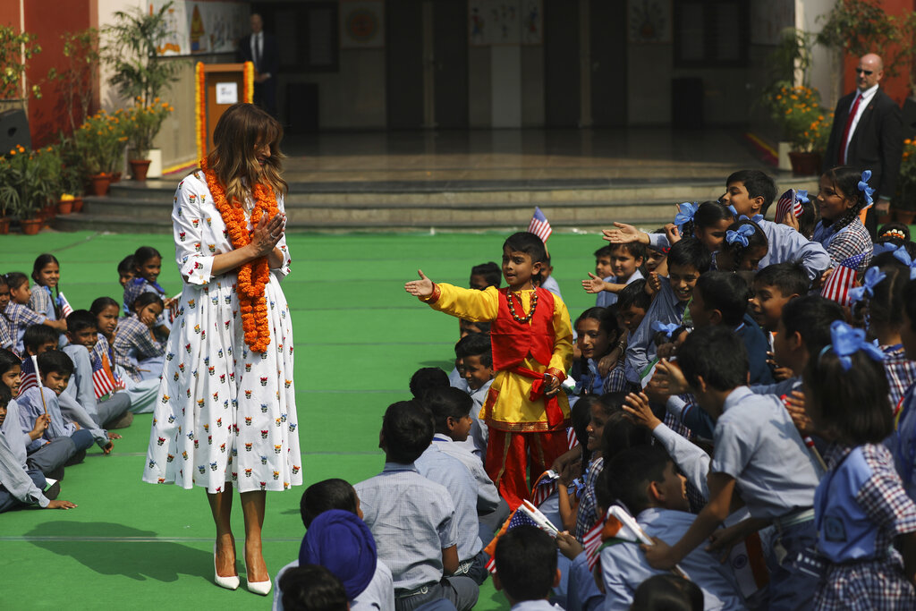 US first lady Melania Trump greets Indian style as children try to reach out to shake hands with her at Sarvodaya Co-Educational Senior Secondary School in New Delhi