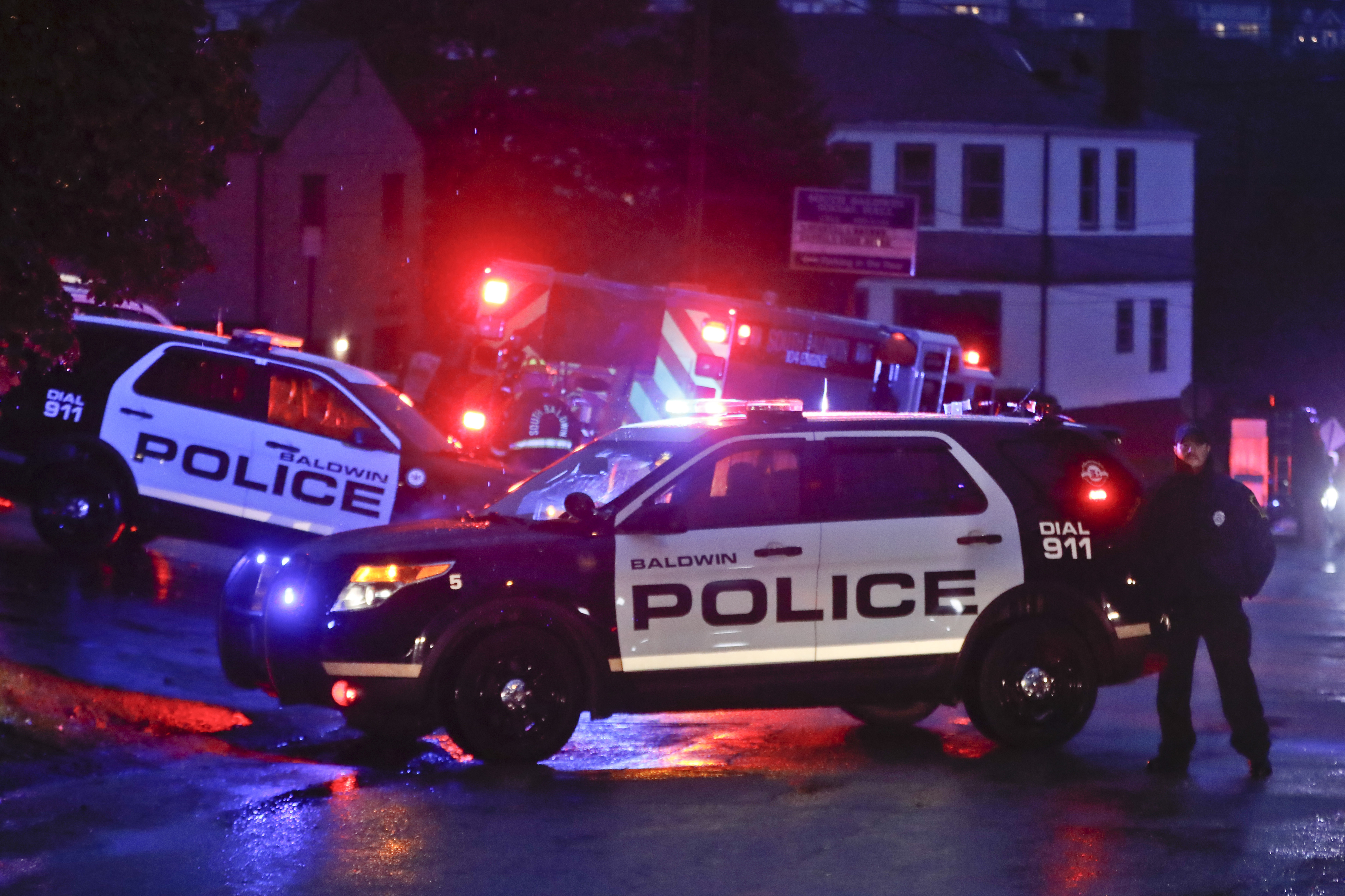 Emergency vehicles block off an area as authorities continue their investigation of a shooting in a Pittsburgh synagogue where multiple people were killed on October 27.