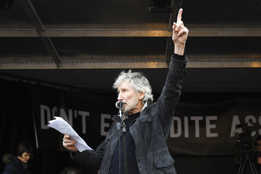 British musician Roger Waters gestures as he speaks at a rally in Parliament Square as part of the demonstration against the extradition to the US of Wikileaks founder Julian Assange in London, Saturday, February 22, 2020.