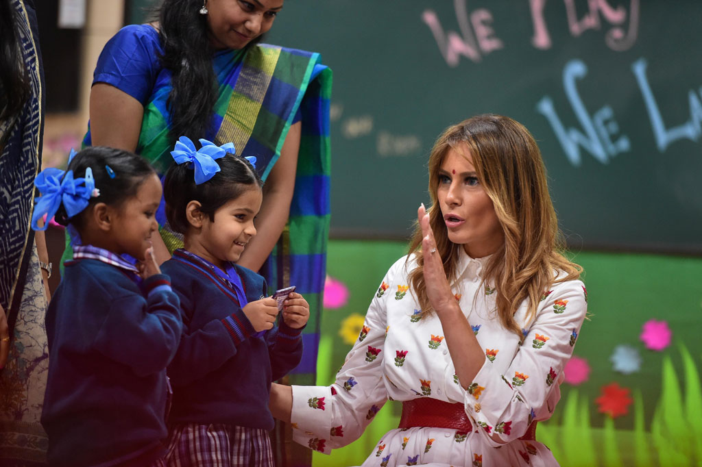 US First Lady Melania Trump interacts with school children during her visit to a government school to witness various activities as part of the happiness curriculum, in New Delhi