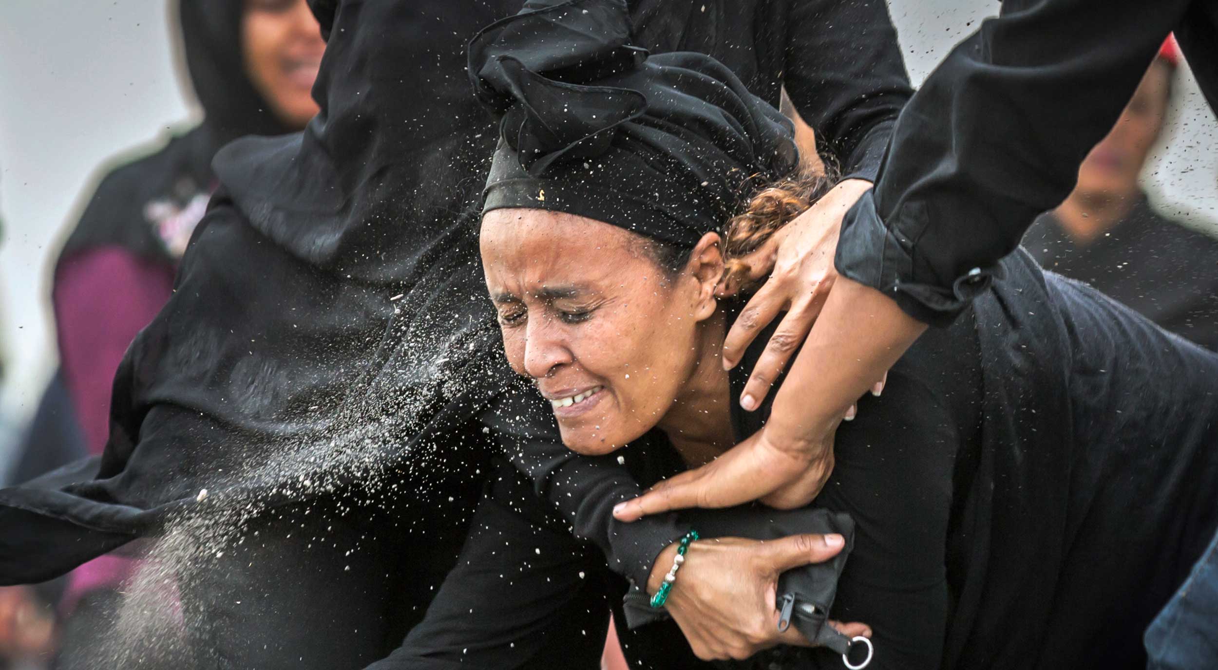 An Ethiopian relative of a victim throws dirt on her face after realising that there is nothing physical left of her loved one at the Ethiopian Airlines crash site southeast of Addis Ababa on Thursday. 