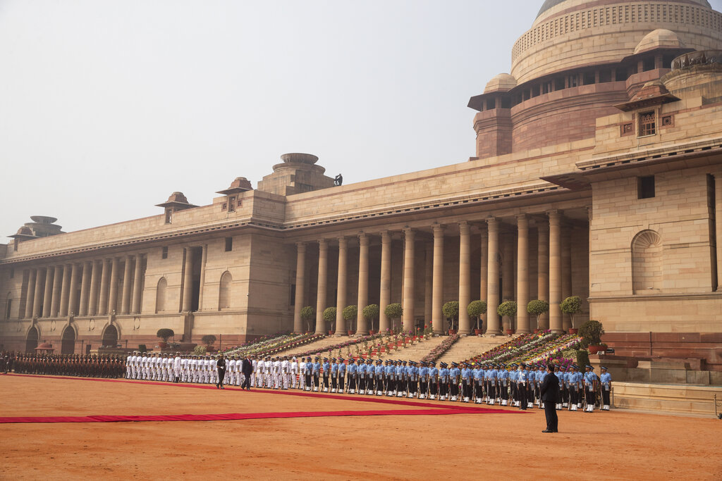 US President Donald Trump reviews a guard of honor during a ceremonial reception at Rashtrapati Bhavan, the Indian Presidential Palace, in New Delhi