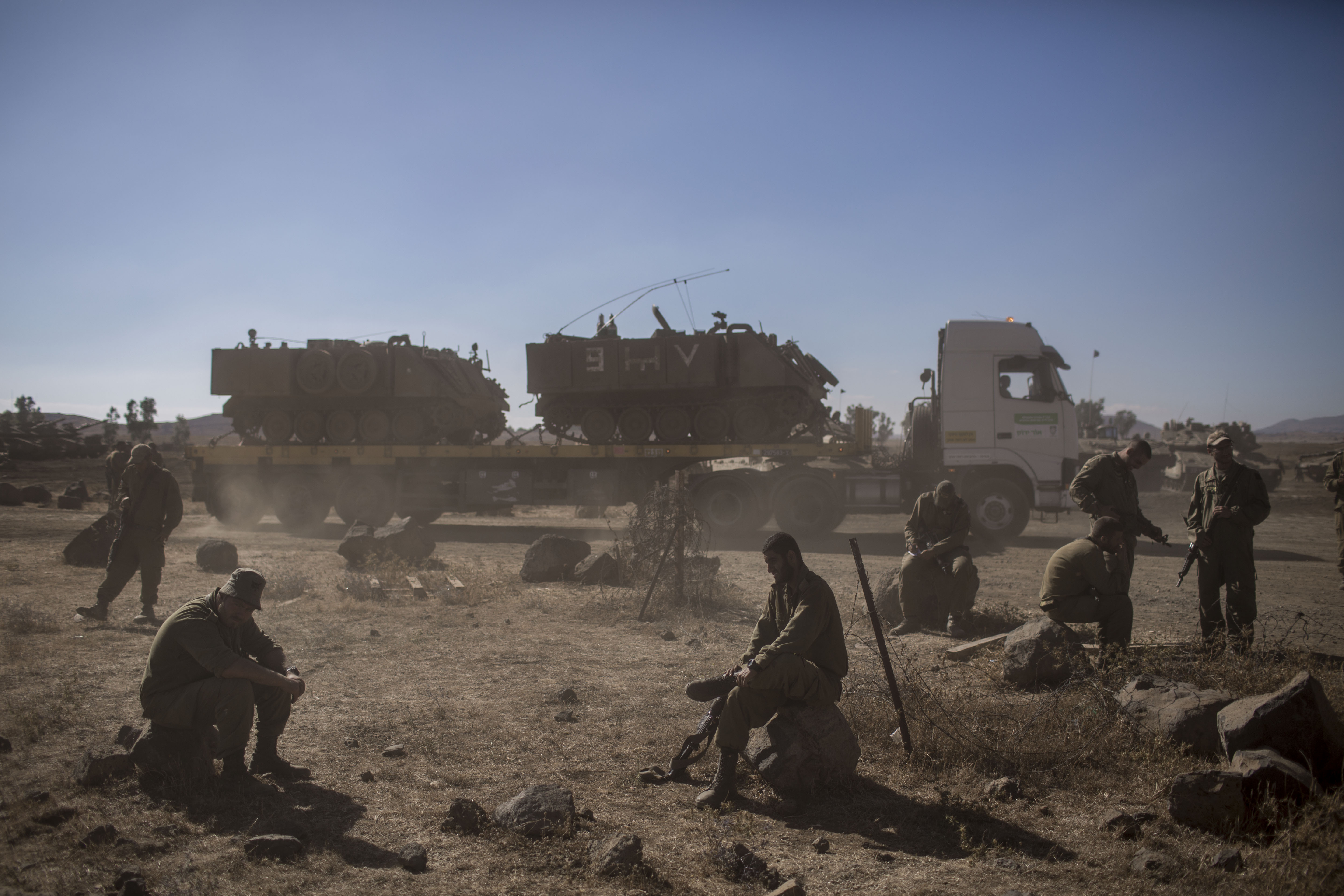 Israeli soldiers take part in exercises near the village of Keshet, in the Israeli-annexed Golan Heights, on June 23, 2015.