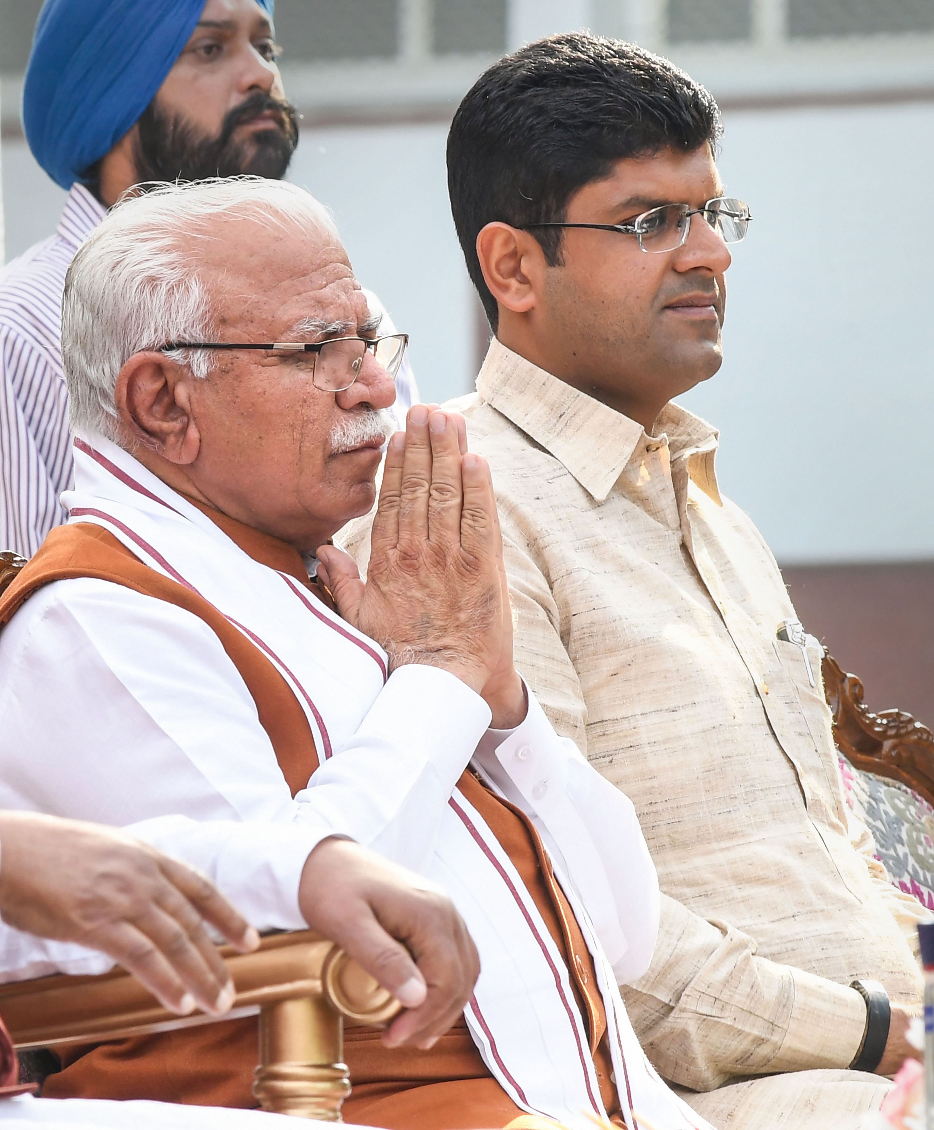 Haryanas chief minister Manohar Lal Khattar and deputy chief minister Dushyant Chautala after taking oath during a swearing-in ceremony, in Chandigarh, Sunday, October 27, 2019.