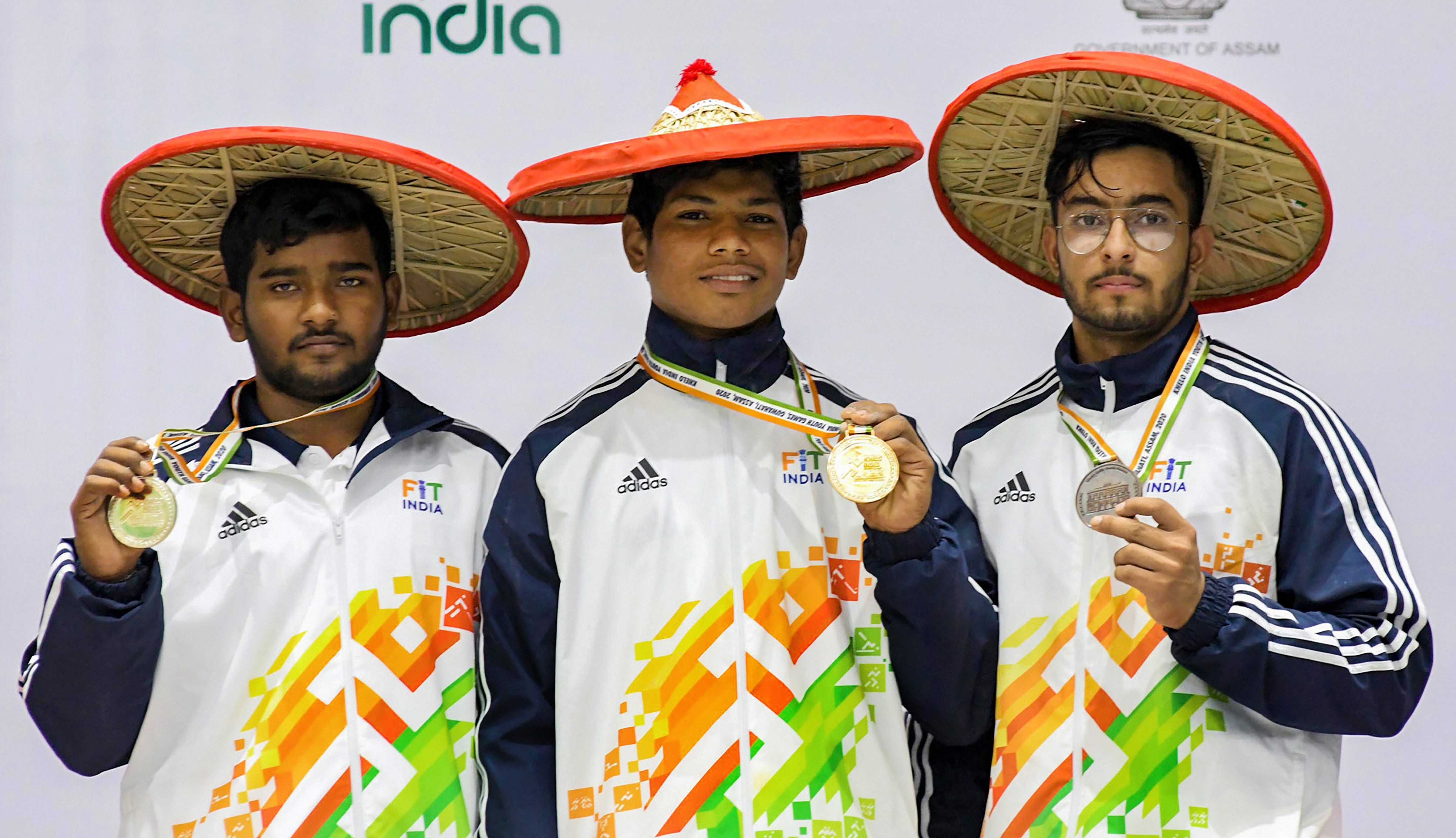 Winners of Boys Under-17 Weightlifting (81kg) gold medallist Shaik Lal Basheer of Andhra Pradesh, flanked by silver maedallist Ravishakra of Andhra Pradesh and Bronze medallist Aditya Narang of Chandigarh at the third edition of Khelo India Youth Games, in Guwahati, January 20, 2020.