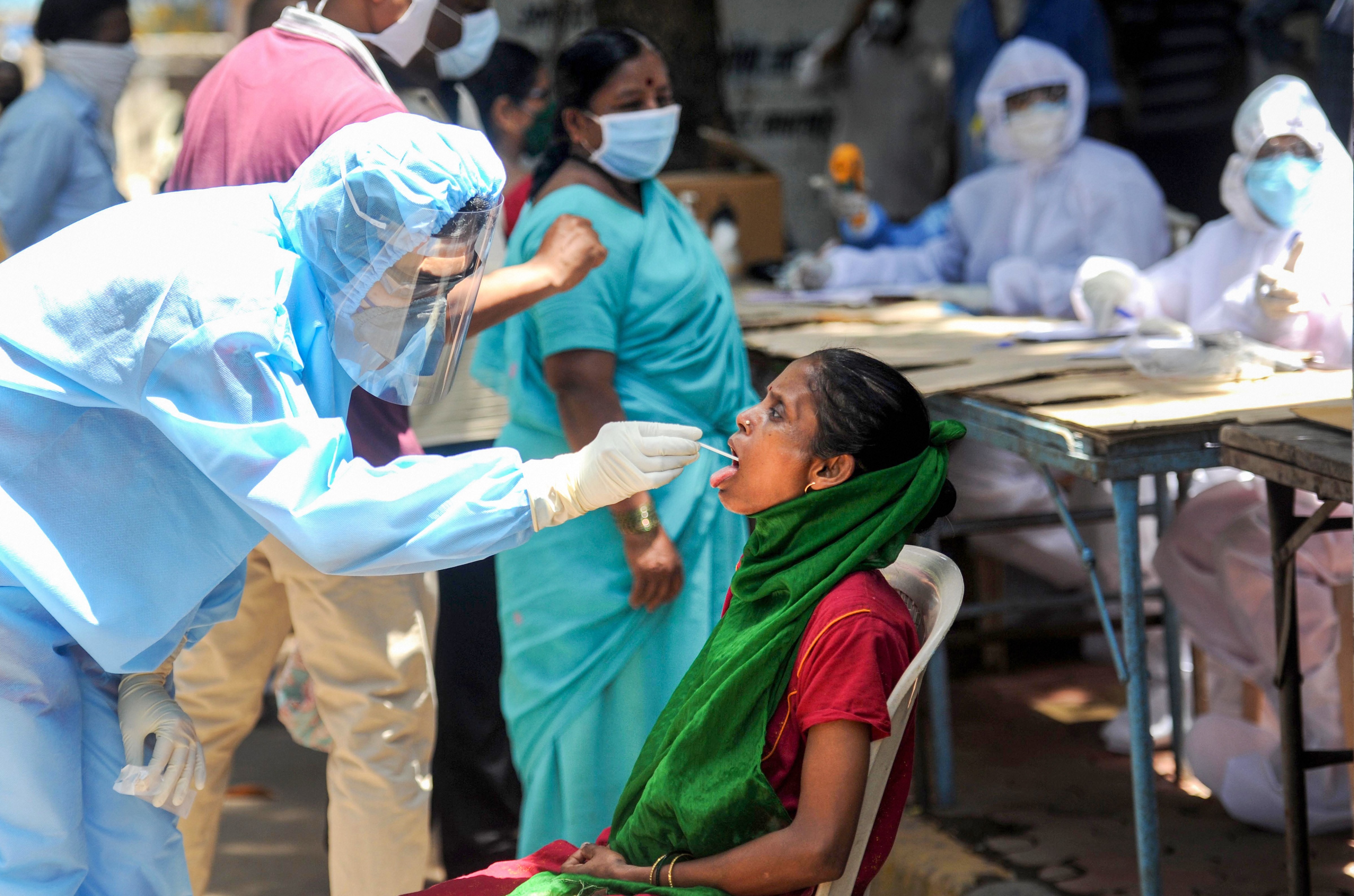 Medics conduct Covid-19 screening of residents at a camp, during the ongoing nationwide lockdown to curb the spread of coronavirus, at Dharavi in Mumbai, Friday, May 22, 2020. 