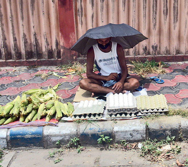 Anup Das, who used to be a peon before the lockdown, now sells corn and eggs opposite IA Market
