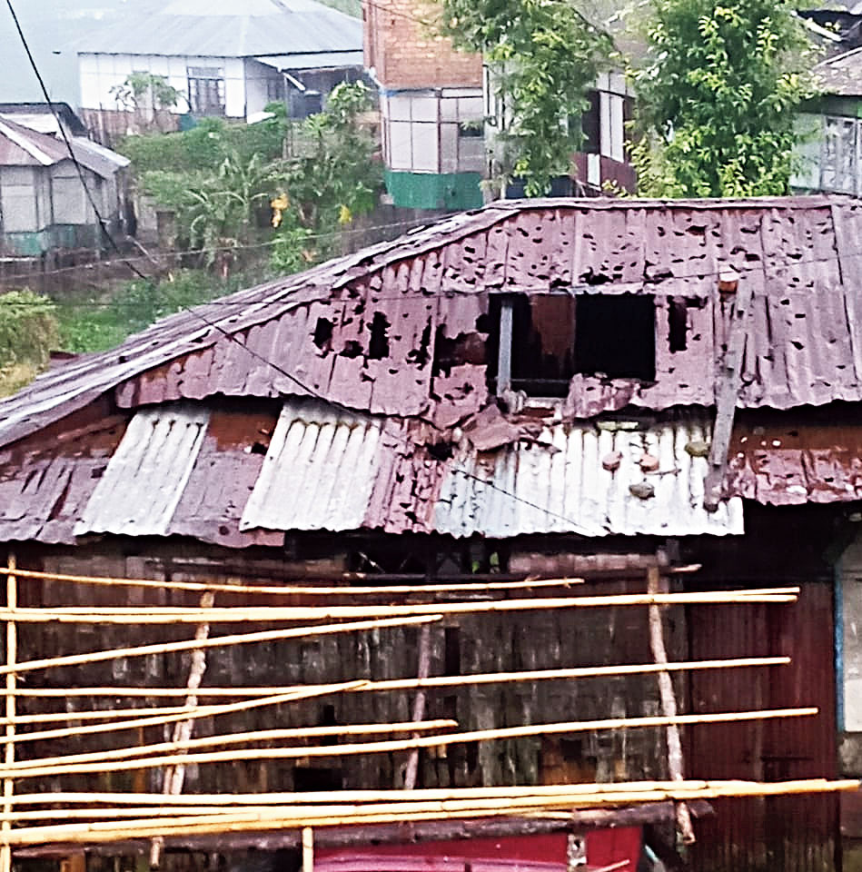 A damaged house at Hliappui village. 
