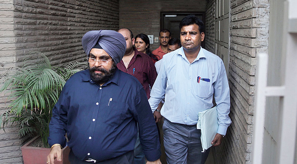 CBI officers leave the residence of Indira Jaising after conducting the raid in New Delhi on Thursday. 