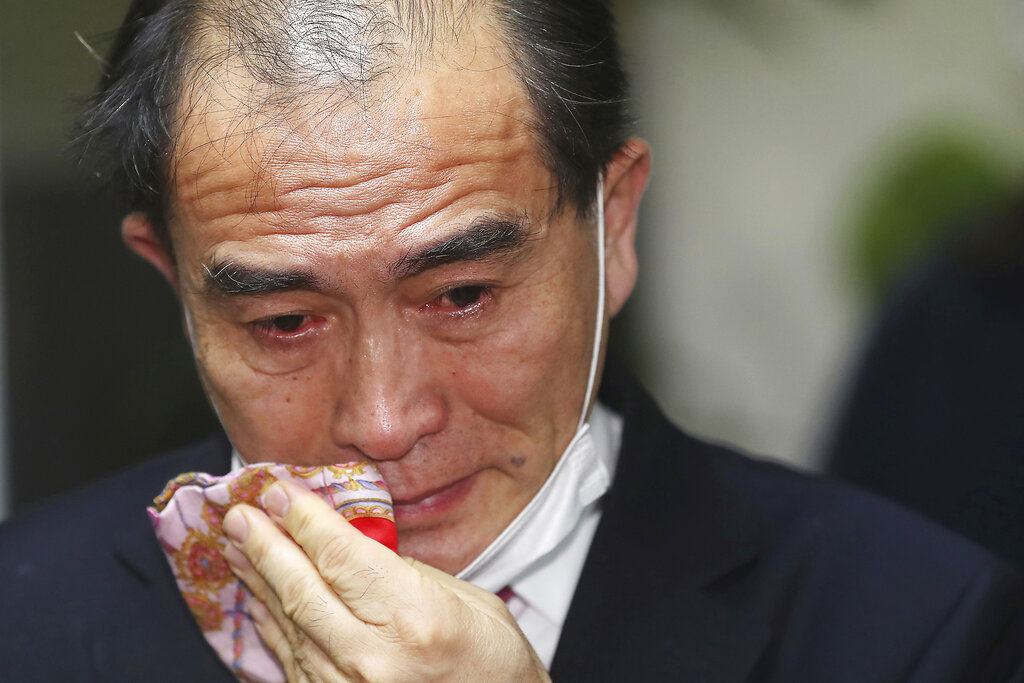 Thae Yong Ho, former North Korean diplomat, who defected to South Korea in 2016 and a candidate of the main opposition United Future Party, wipes his tear after he was certain to secure victory in the parliamentary elections in Seoul, South Korea, Thursday, April 16, 2020. Thae on Thursday won a constituency seat in South Korea's parliamentary elections, the first such achievement among tens of thousands of North Koreans who have fled their authoritarian, impoverished homeland.