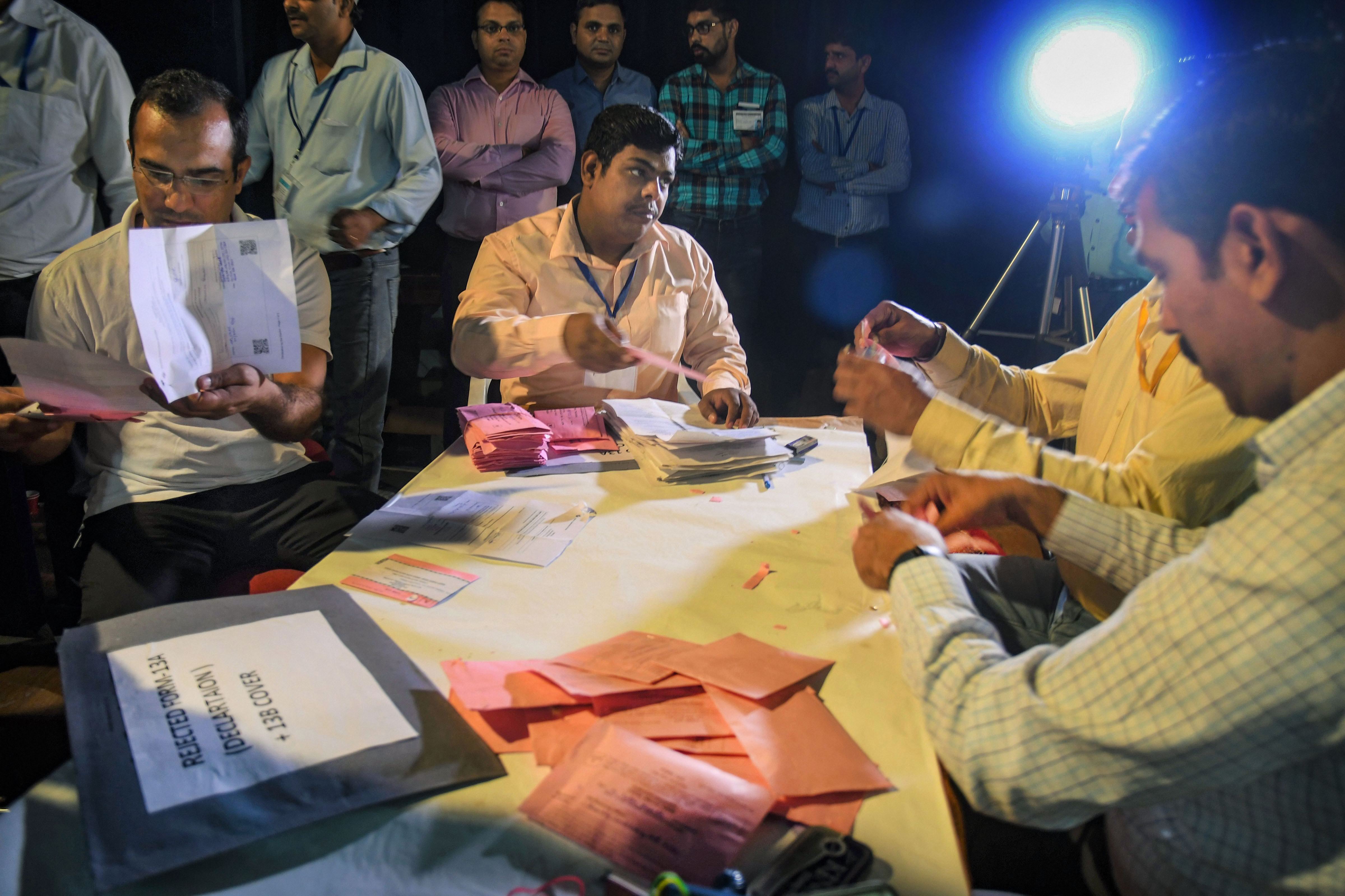 Election officials count votes for Haryana Assembly elections, at a counting centre in Panchkula, Thursday, October 24, 2019. 