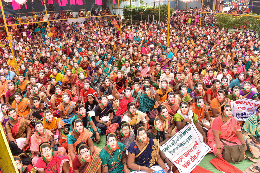 Anganwadi workers wearing masks of social reformer and educationalist Savitribai Phule stage a protest in Solapur on January 2
