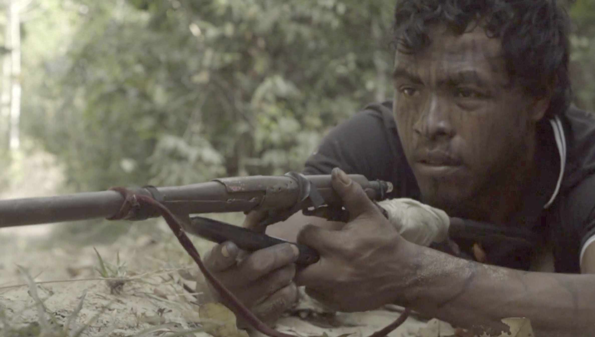 In this September 2019, video frame, Paulo Paulino Guajajara, a Forest Guardian protecting the Arariboia indigenous reserve poses with his makeshift weapon, at the reserve in Maranhao state, Brazil. He was killed in an ambush by illegal loggers on  November 1, 2019