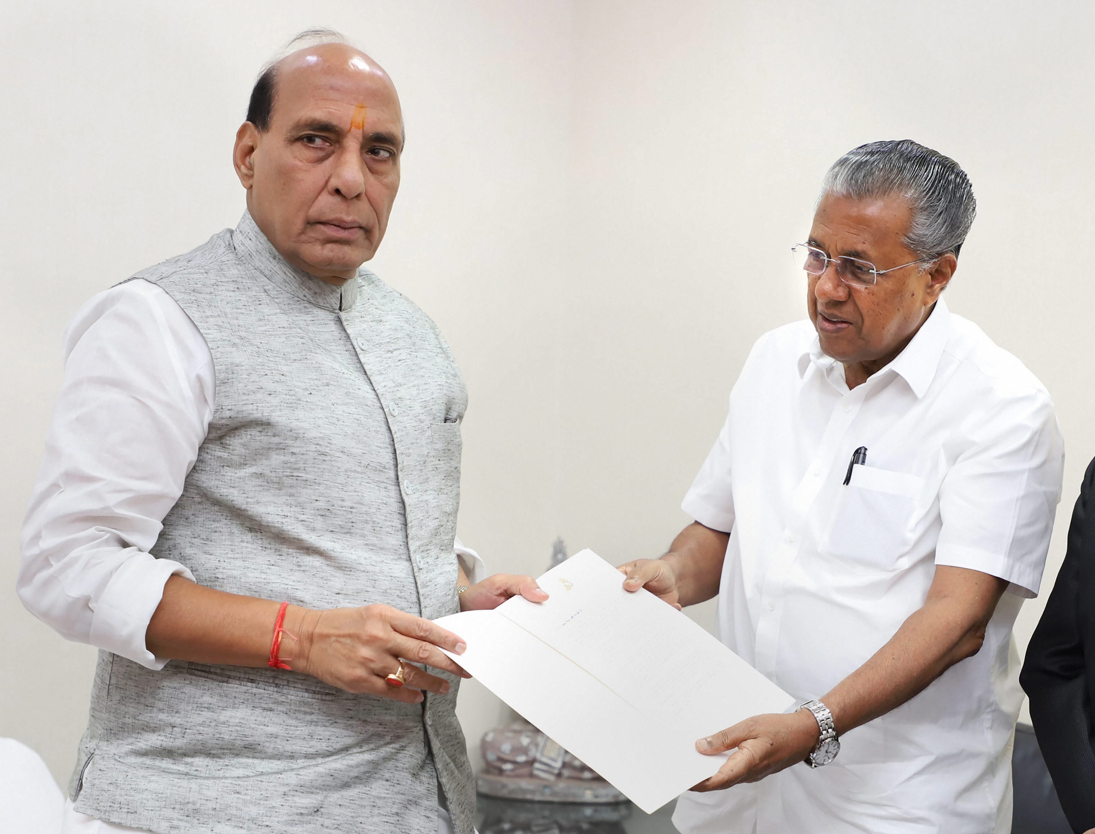 Home minister Rajnath Singh (left) with Kerala chief minister Pinarayi Vijayan in New Delhi on Wednesday.