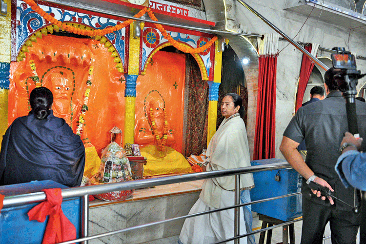 Mamata offers prayers at the Kapil Muni Ashram in Sagar Island on Monday. 
