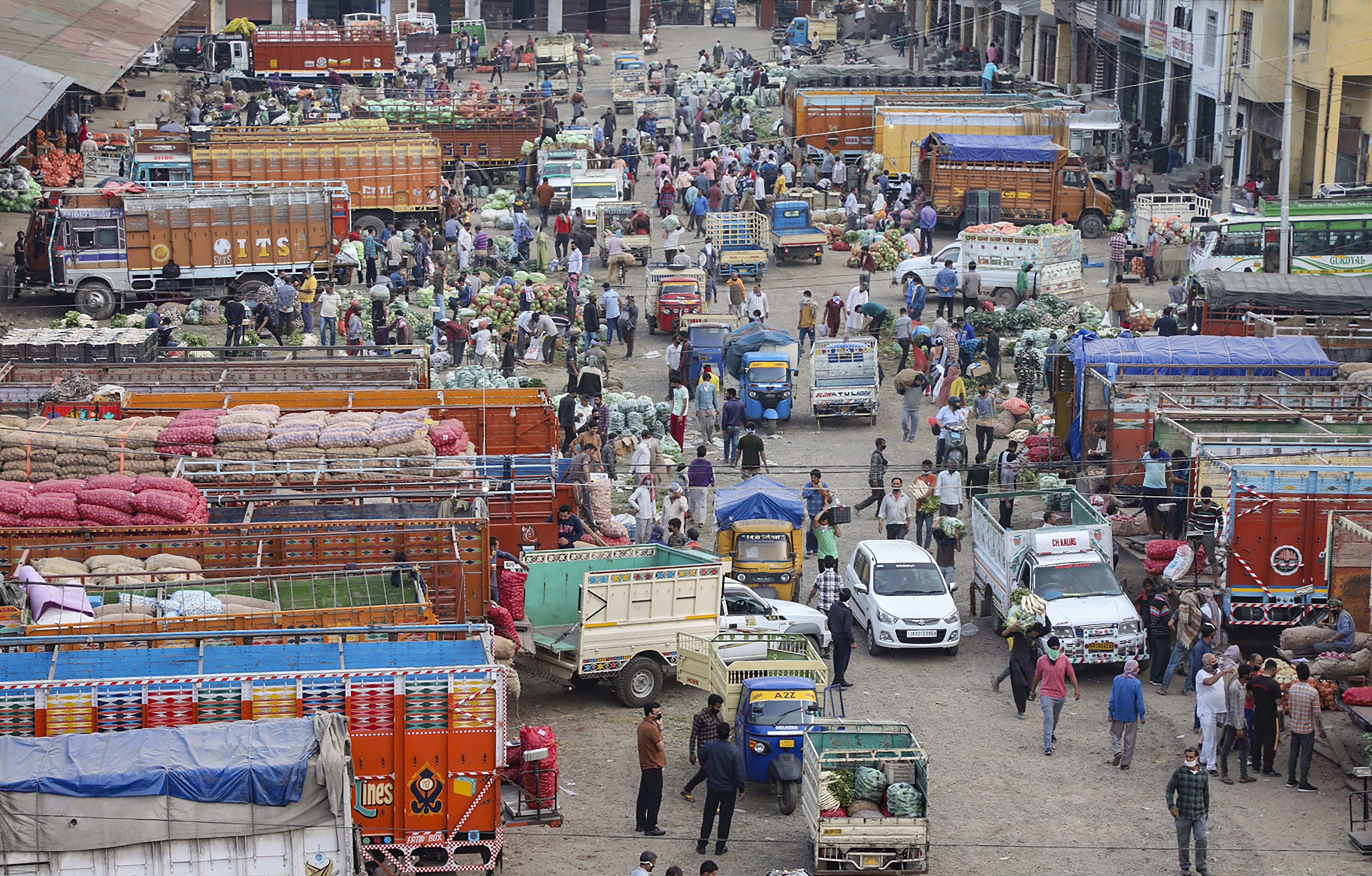A view of the wholesale vegetable market at Narwal during the nationwide lockdown imposed in wake of coronavirus pandemic, in Jammu, Tuesday, April 14, 2020