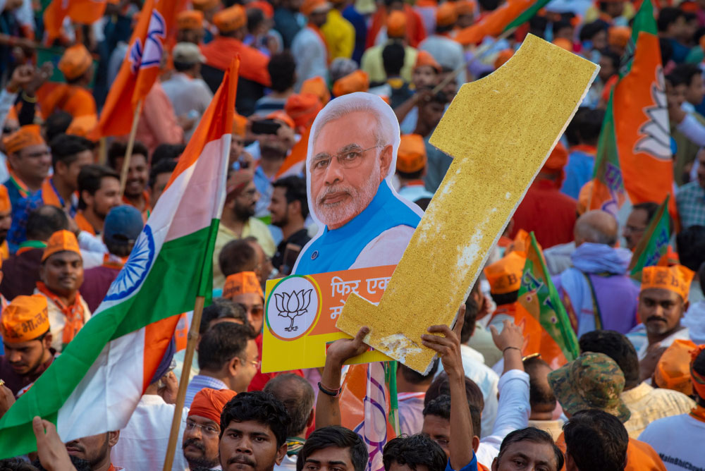 Workers and supporters of the BJP attend Prime Minister Narendra Modi's roadshow in Varanasi on April 25, 2019.