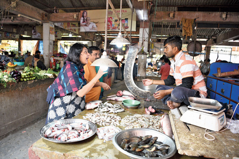 Another campaigner explains it to a fish seller