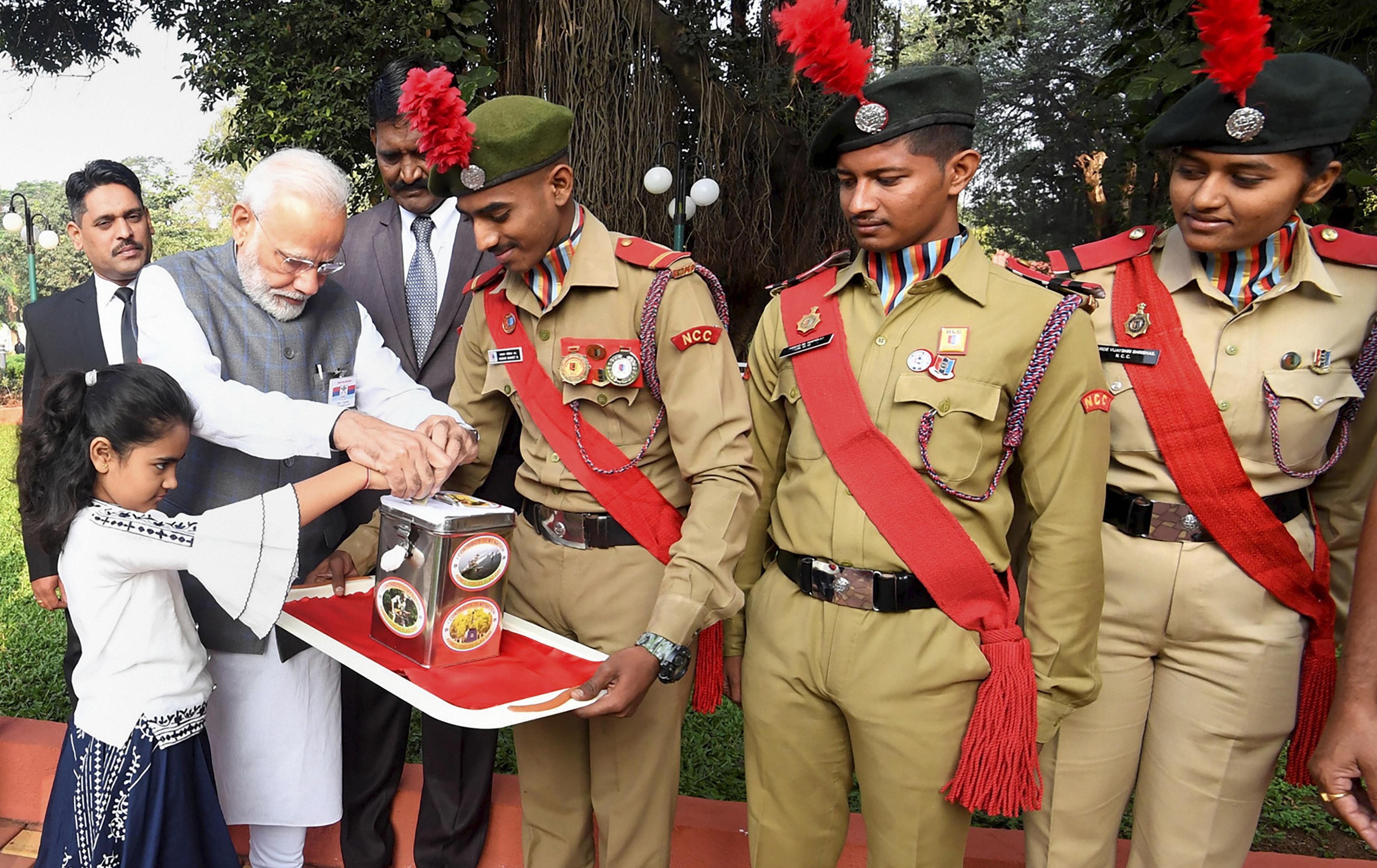 Prime Minister Narendra Modi makes a contribution for the welfare of Armed Forces, on the occasion of the Armed Forces Flag Day, in Pune, Saturday, December 7, 2019.