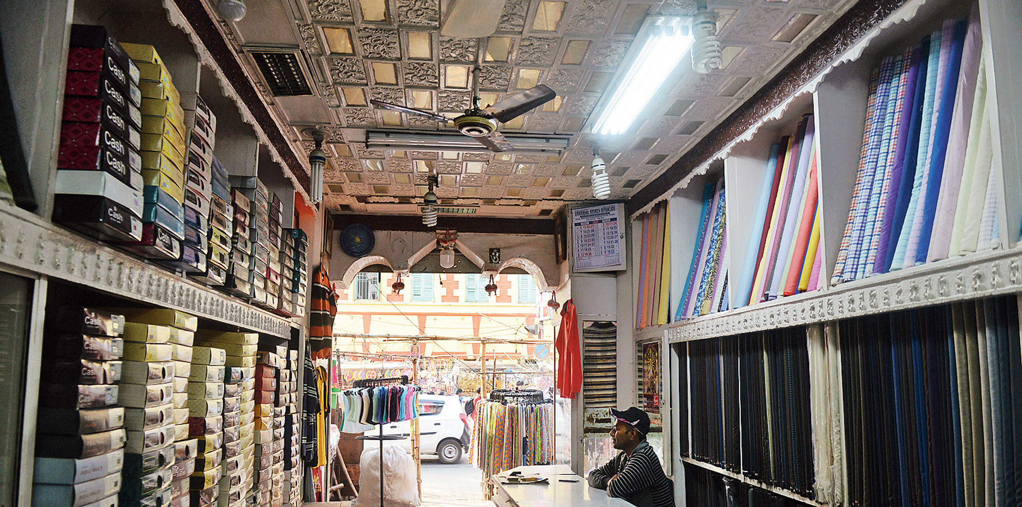 A garments shop at Hatibagan in north Calcutta basks in daylight on Tuesday for the first time since 2008 after the hawkers’ stalls in front pulled down their tarpaulin and plastic covers at the behest of deputy mayor Atin Ghosh, who is also the president of the hawkers’ union there.