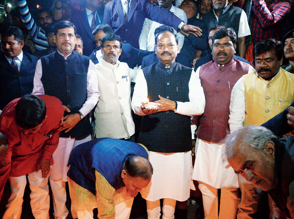Chief minister Raghubar Das (clockwise from top) lights a diya at Albert Ekka Chowk in Ranchi on Tuesday in support of the airstrike.