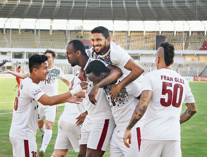 Mohun Bagan players celebrate after Baba Diawara (second from right) scored the first goal against Churchill Brothers in Margao on Saturday
