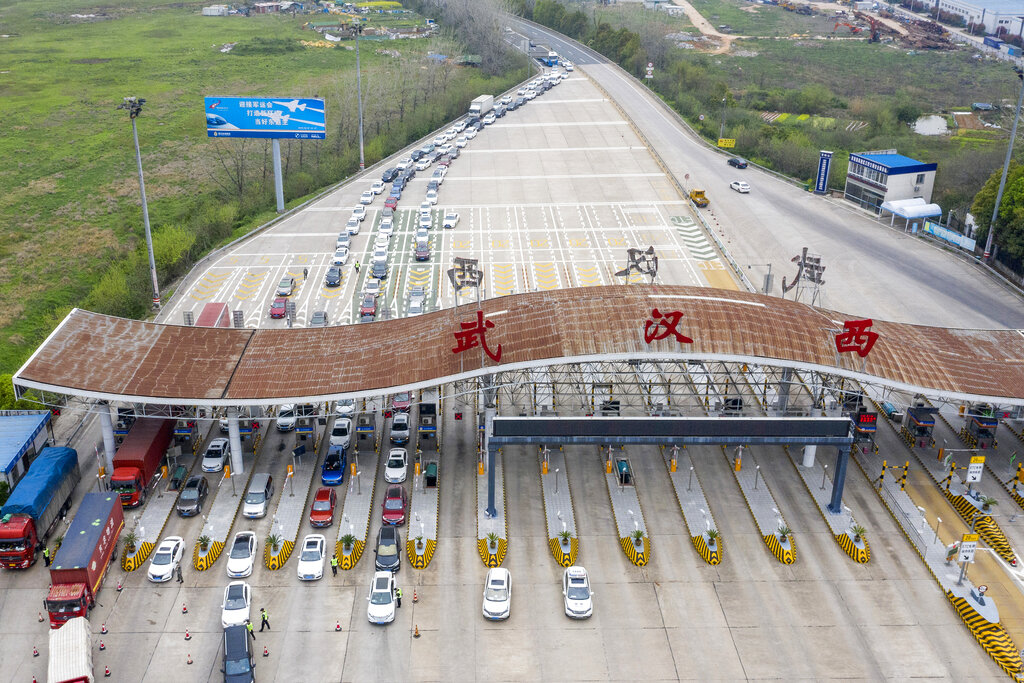 An aerial photo shows vehicles waiting to cross into Wuhan at a highway toll station in Wuhan, in central China's Hubei Province