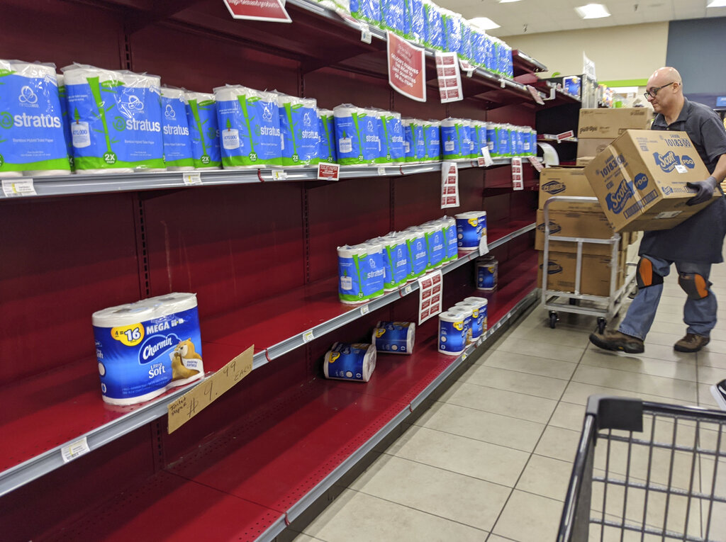 Toilet paper is restocked at the Gelson's Market in Los Feliz neighborhood of Los Angeles on Thursday, March 26, 2020.