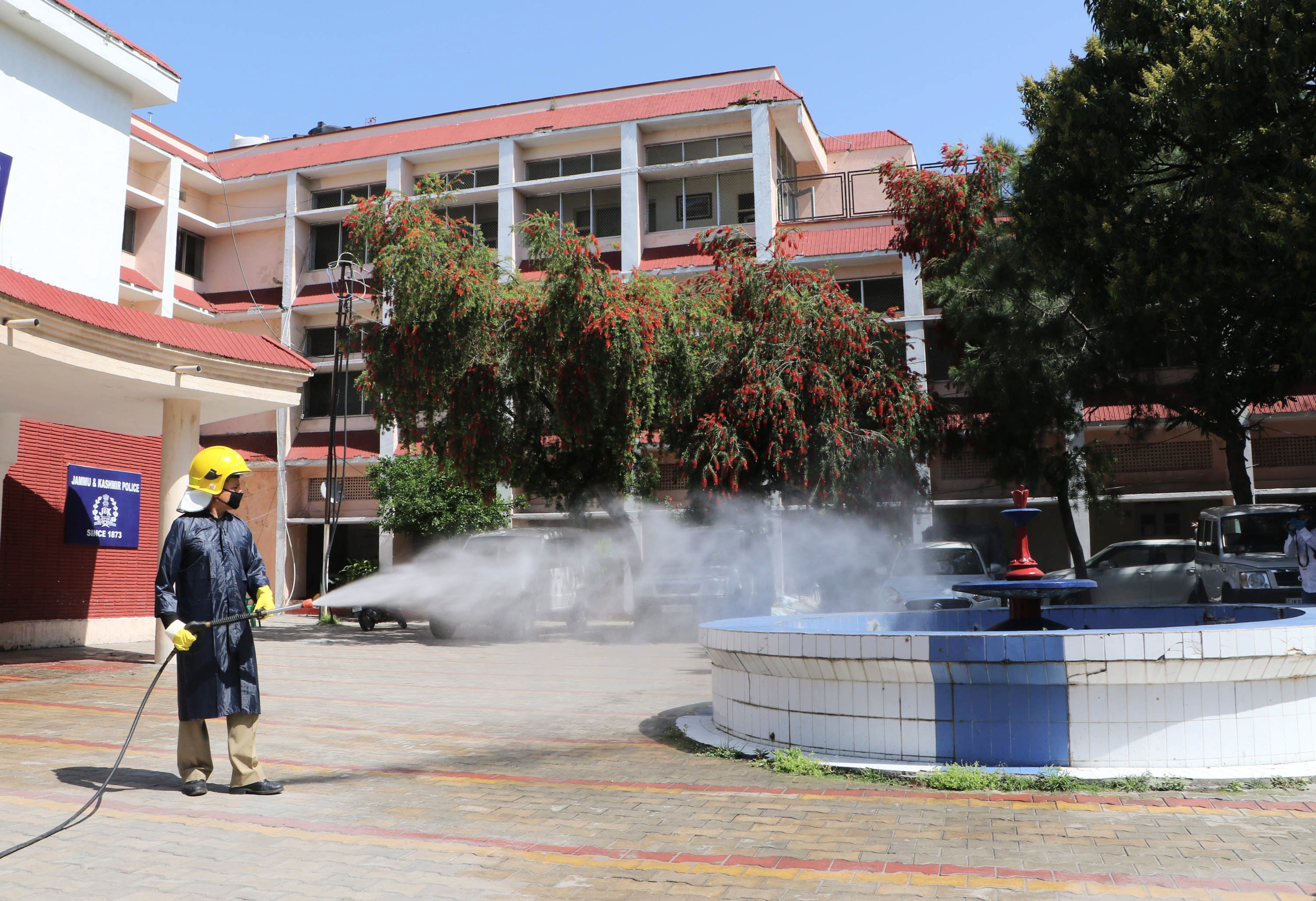 A fire fighter sanitises an area during the nationwide lockdown, imposed in the wake of coronavirus pandemic, in Jammu, Wednesday, April 1, 2020