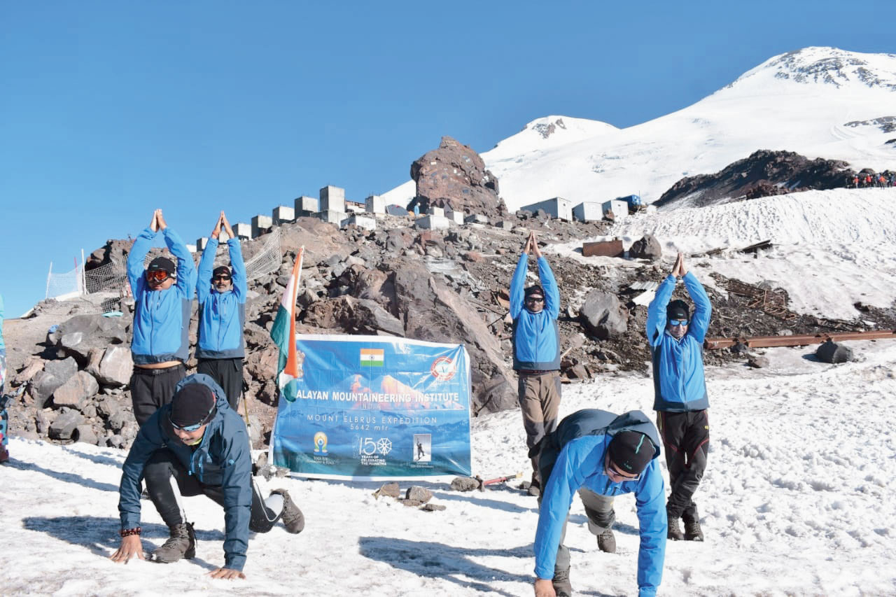 The team perform yoga at the summit of Mt. Elbrus on August 15