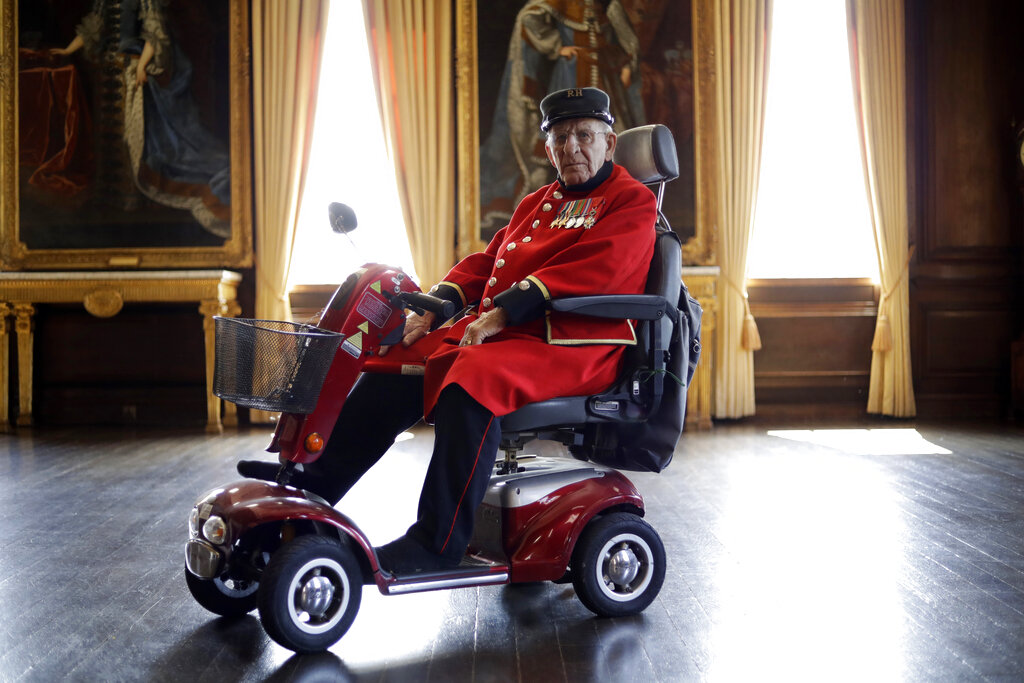 British Chelsea Pensioner and D-Day veteran Frank Mouque poses for a portrait during a D-Day 75th anniversary event in the State Apartments at the Royal Hospital Chelsea in London. Mouque, who can't hear well now and answered media questions by reading them from a piece of paper, was a Sapper and Corporal in the British Royal Engineers. On D-Day he landed on Sword beach and carried with him 21 pounds of explosives to blow down telegraph poles.