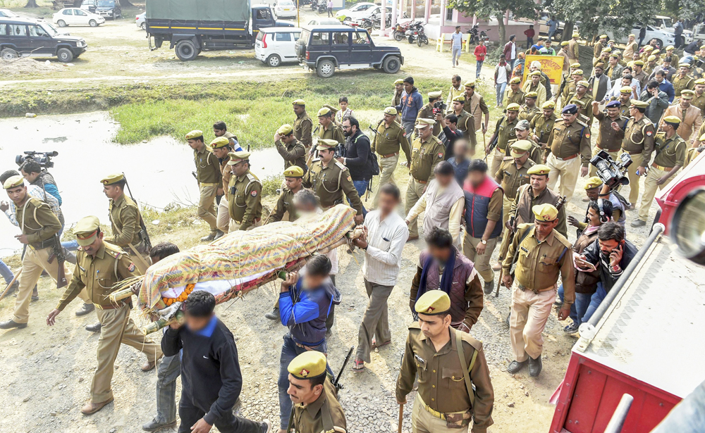 Family members and relatives carry the mortal remains of the Unnao rape victim for burial under tight security at Unnao on Sunday, December 8, 2019. The woman was set on fire by 5 men, including 2 of her alleged rapists, on Thursday morning when she was going to Rae Bareli to attend a court hearing.
