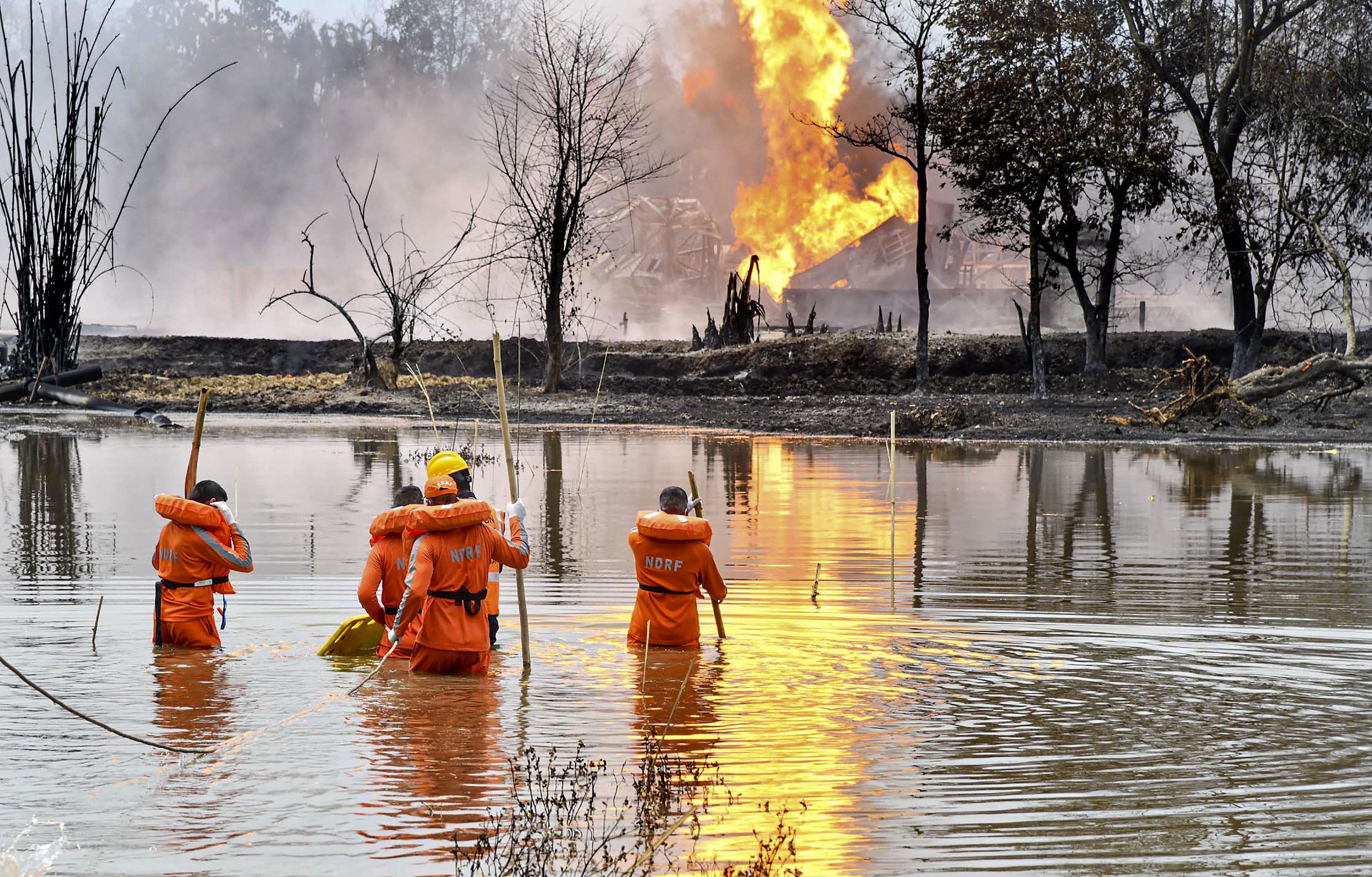National Disaster Response Team (NDRF) personnel carry out search and rescue operations after two firemen of Oil India Limited went missing since an oil well at the company’s Baghjan oilfield exploded, in Assam’s Tinsukia district, Wednesday, June 10, 2020. The firemen were found dead by the team. 