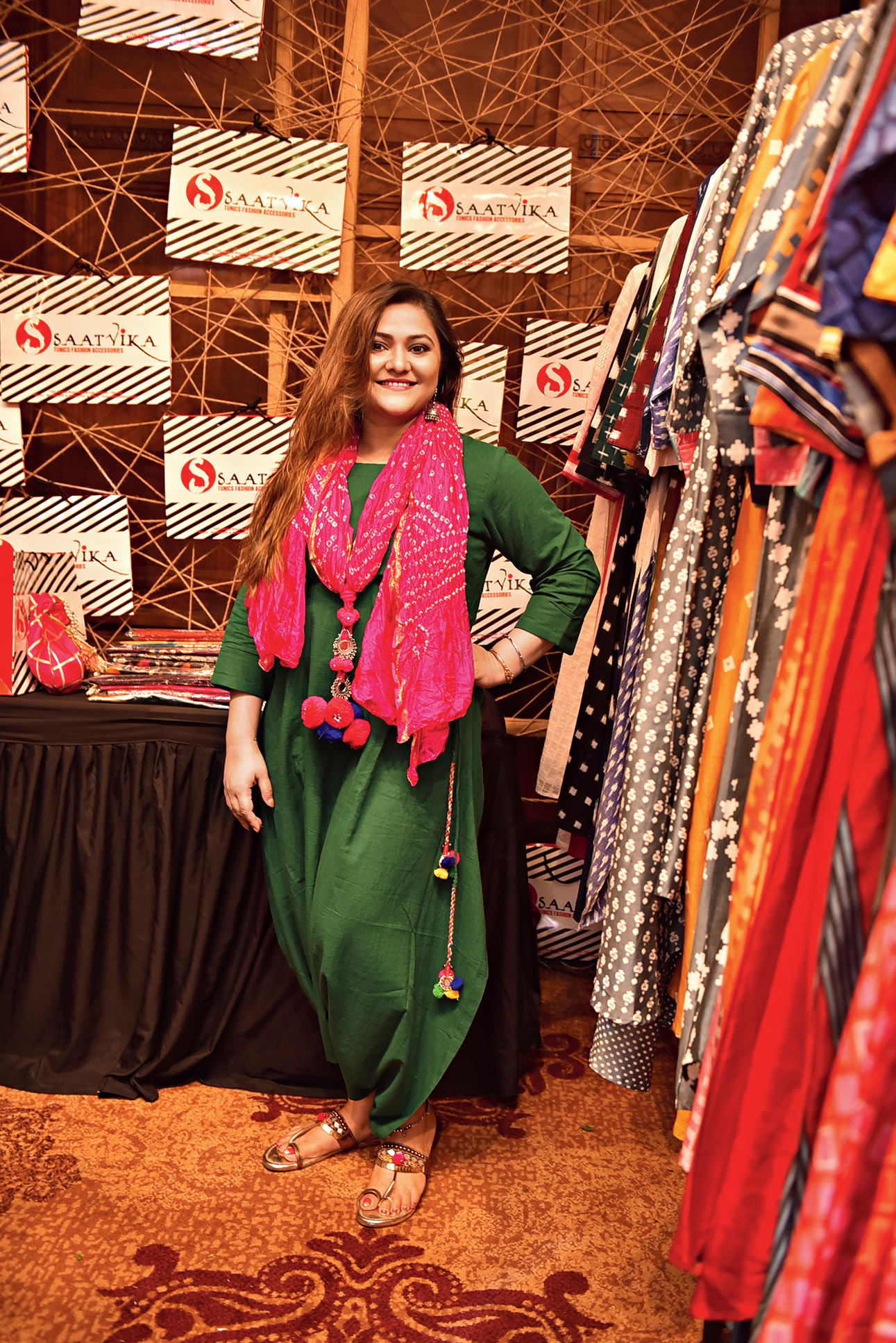 Koneenica Banerjee dressed in this stylish green boxy tunic from Saatvika, teamed with a hot pink bandhni scarf.